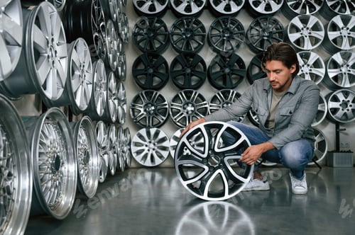 Preview: Big choice. Man is in the tire fitting car service