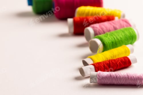 Preview: Composition of colourful sewing crewels on white background with copy space
