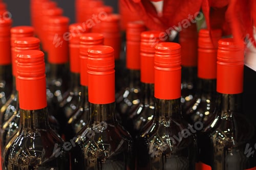 Preview: Glass beautiful bottles with red wine.