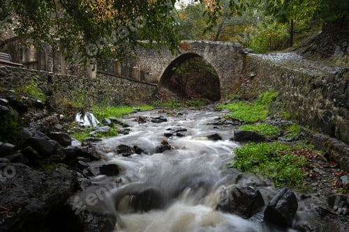 Preview: Medieval stoned bridge water flowing in the river