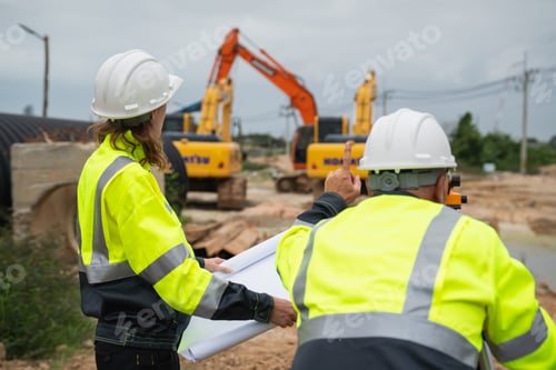 Preview: The survey team is using a theodolite and road construction plans.