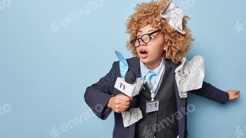 Preview: Scared woman correspondent works in mass media sphere being in hurry poses with microphone in hand