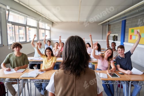 Preview: High school students raising hands to answer teacher's question in classroom.