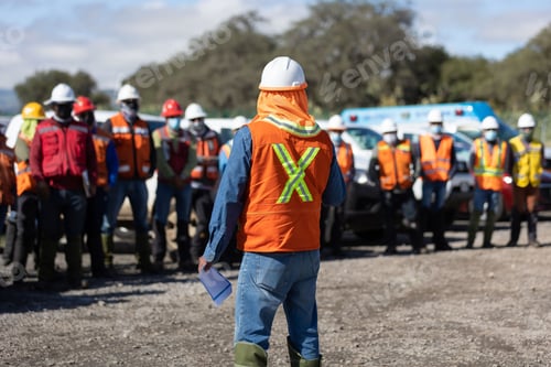 Preview: Team leader assigning a job for the team of technicians, foreman and engineers in a meeting