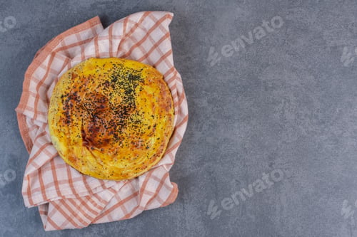 Preview: Fresh pastry with black sesame seeds on tablecloth