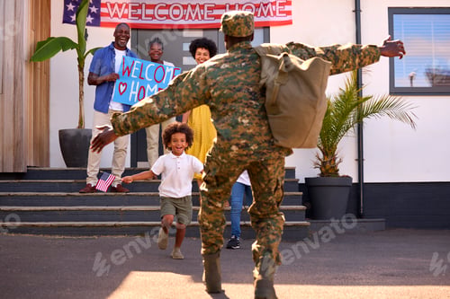 Preview: Multi-Generation Family Welcoming Army Father Home On Leave With Banner
