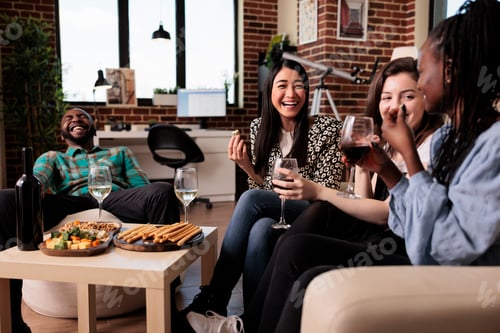 Preview: Close friends having wine party and laughing with mouth wide open while celebrating friendship event