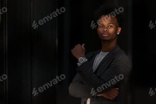Preview: Black businessman posing on street