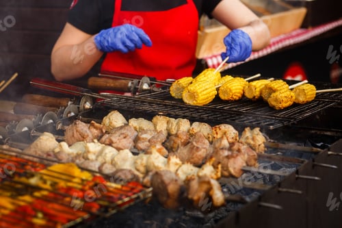 Preview: Delicious vegetables grilling on open grill, outdoor kitchen