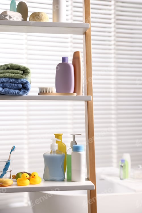 Preview: Baby bath accessories and care products on rack in bathroom