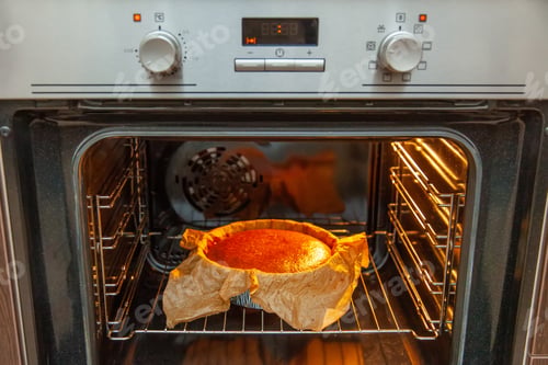 Preview: Cooking process homemade Basque burnt cheesecake. Ready toasted cheesecake is in the oven