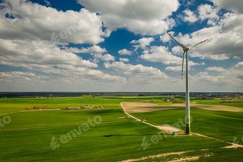 Preview: White wind turbines on green field, Poland from above