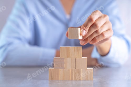 Preview: hand stack woods block step on table. business development concept.copy space.