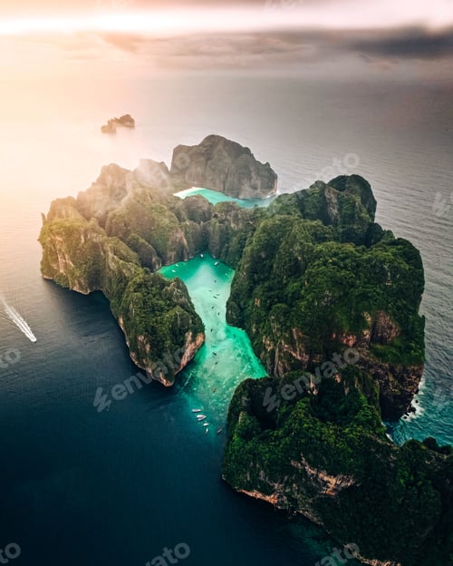 Preview: Aerial view of a forested green rocky island with a sandy beach in Thailand, Krabi, Phi Phi Island