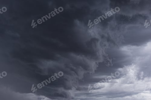 Preview: Breathtaking low angle shot of dark gray cloud formation in the sky