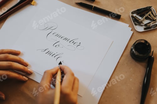 Preview: Close-up image of calligrapher working.