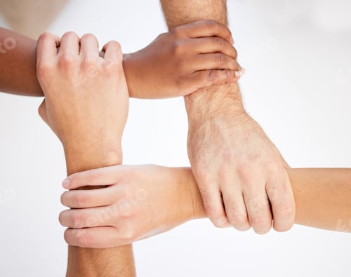 Preview: Cropped shot of a group of unrecognizable businesspeople linking arms