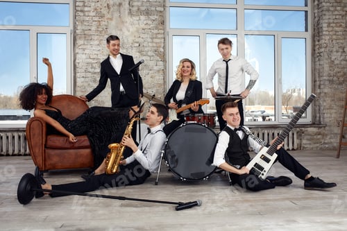 Preview: Repetition of multi ethnic jazz band in loft. Bass guitar player, electric guitar player