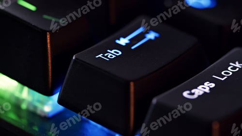 Preview: Keyboard key - Tab - macro shot. Modern gaming keyboard close-up with beautiful color backlight.