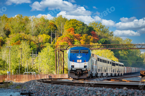 Vista previa: Passenger train in autumn landscape