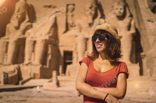 Preview: A young tourist in red dress at the Abu Simbel Temple in southern Egypt in Nubia