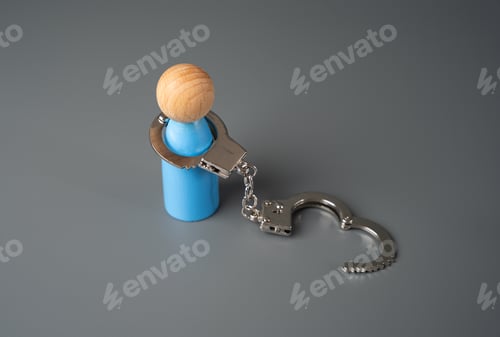 Preview: A man and open handcuffs. Liberated and free.