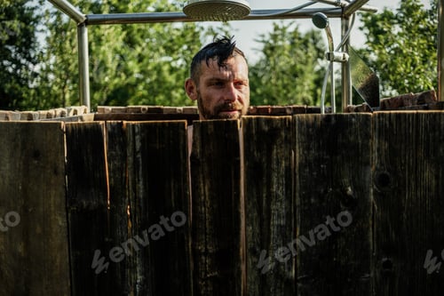 Preview: man taking a shower in the garden