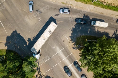 Preview: Top down aerial view of busy street intersection with moving cars traffic