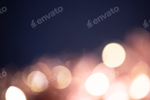 Preview: Blurred Christmas lights over dark blue background
