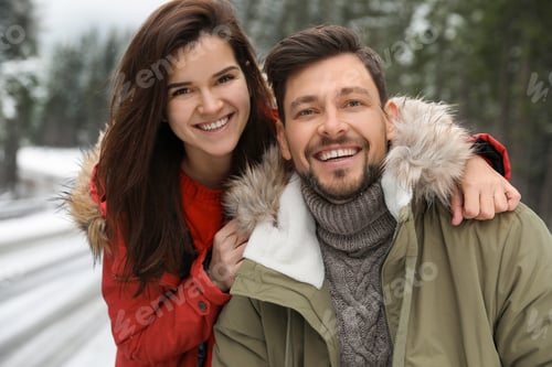 Preview: Couple in warm clothes outdoors. Winter vacation