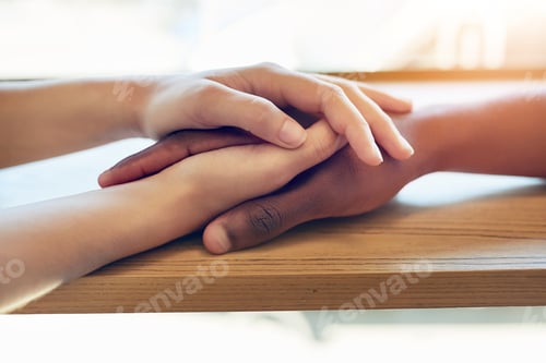 Preview: Shot of an unidentifiable young woman holding a friends hands in consolation