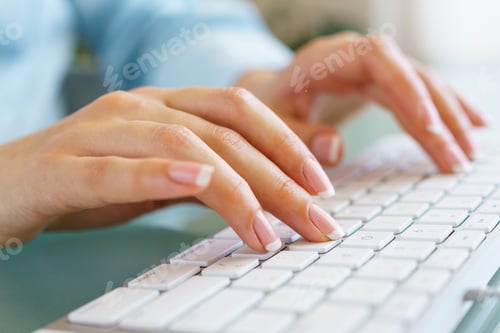Preview: Woman office worker typing on the keyboard