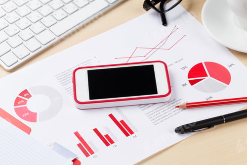 Preview: Office workplace with phone, charts and pc