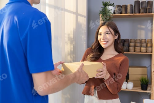 Preview: Asian Woman Received a Caton Parcel Box From a Delivery Man