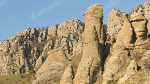 Preview: Picturesque landscape of mountains with green small trees on peaks in late autumn. Shot. Beautiful
