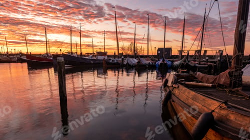 Preview: Urk Flevoland Netherlands sunset at the lighthouse and harbor of Urk Holland