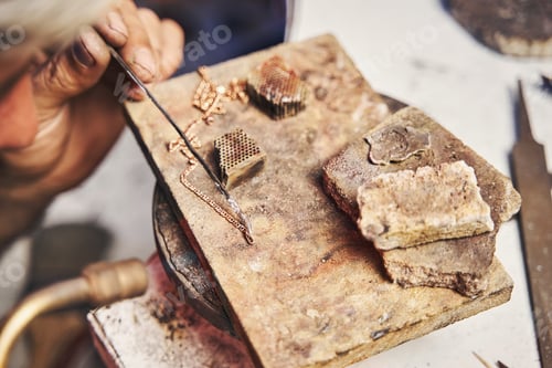Preview: Jewelry making specialist using solder alloy on golden chain