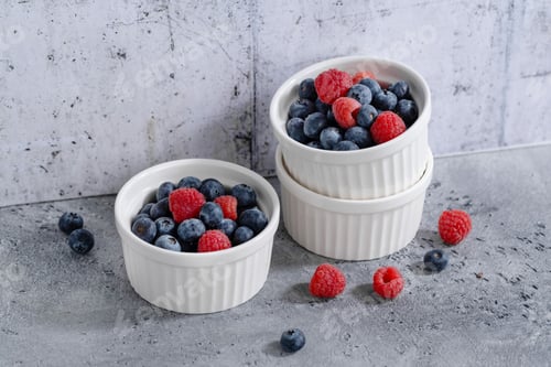 Preview: Fresh berries in small bowls on grey