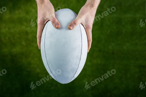 Preview: Upward view of a rugby player catching a rugby ball