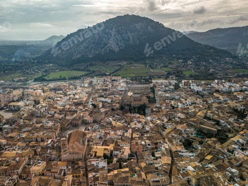 Preview: Aerial view of Pollenca in Mallorca, drone photo in cloudy day