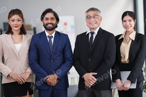 Preview: Group of executive staff standing diligently and politely