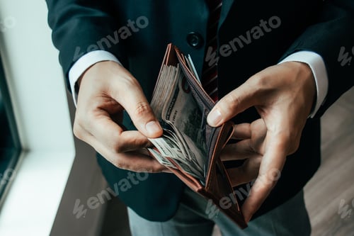 Preview: Suit-Clad Adult with Wallet Full of Cash