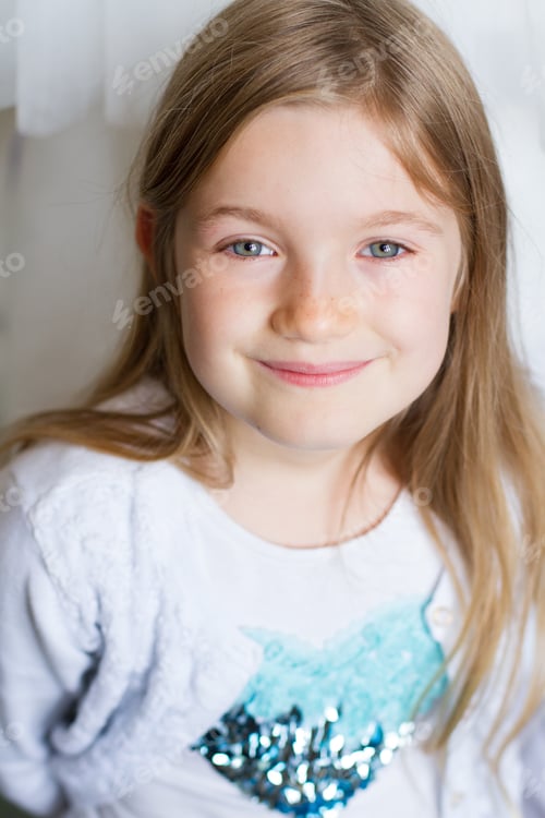 Preview: A close up portrait of a pretty, fair haired girl. NOMINATED