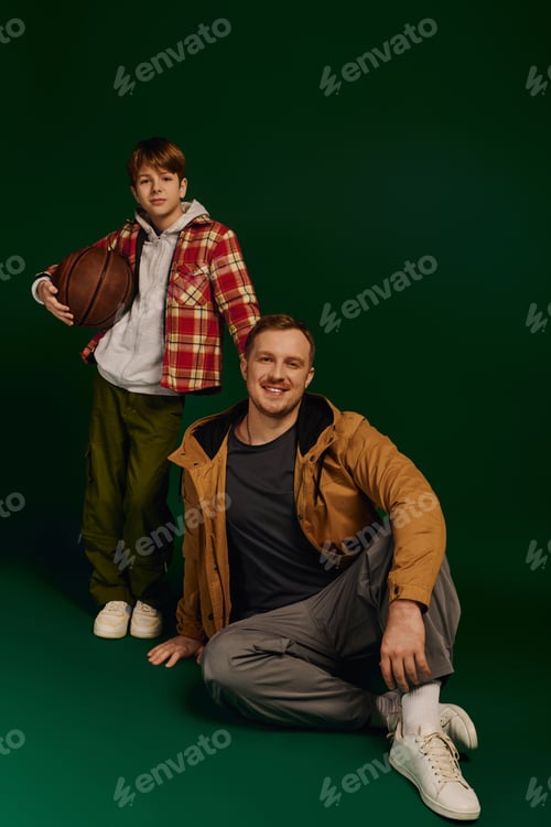 Preview: Joyful moments shared between father and son in a stylish studio setting