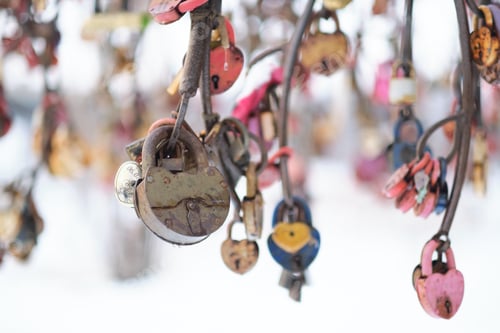 Preview: close up old rusty locks heart shaped on wire rope. Love lock on the bridge. tradition of hanging a