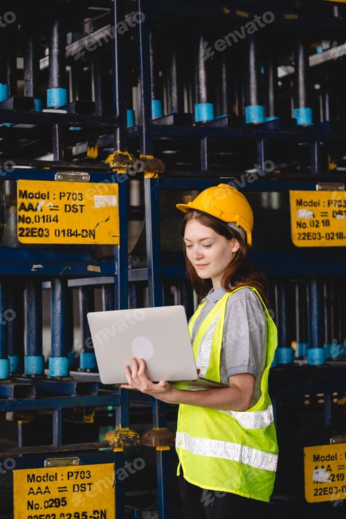 Preview: Portrait female professional engineer factory in protective uniform operating machine