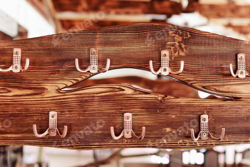 Preview: Close-up of Wood with Metal Coat Hooks