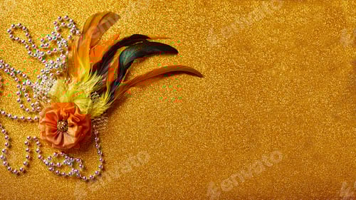 Preview: Festive, colorful Mardi Gras or carnivale mask on golden background. Venetian masks