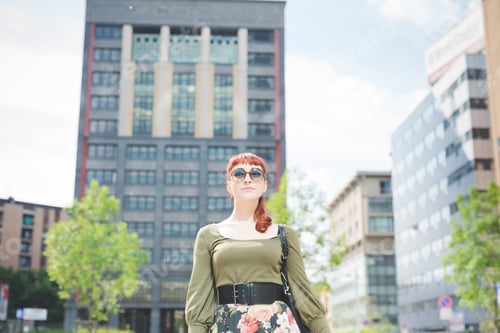 Preview: young handsome redhead caucasian woman posing