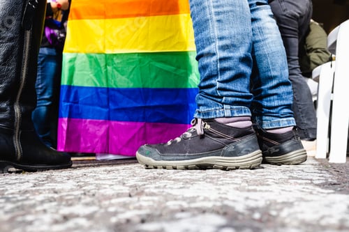 Preview: Group of people walk alongside a flag of the LGBT collective claiming equal rights during a protest